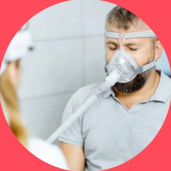 Man wearing a CPAP mask in a clinic