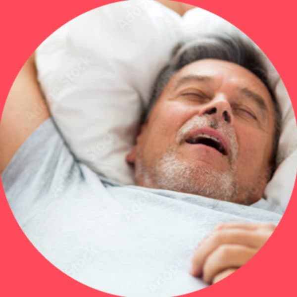 Man snoring with his mouth open while asleep