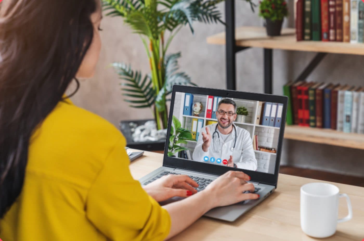 Woman on a video call with a doctor on her laptop