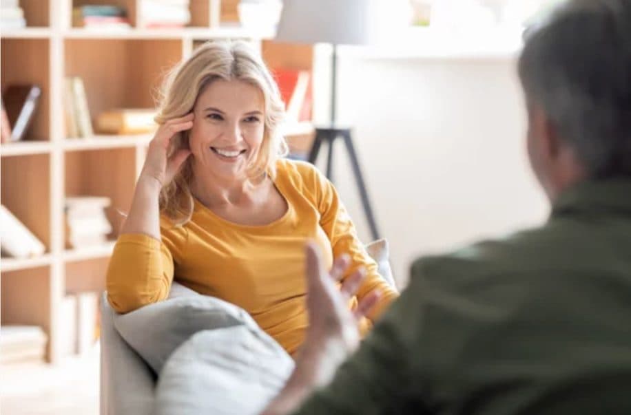 Woman talking with a consultant in a living room