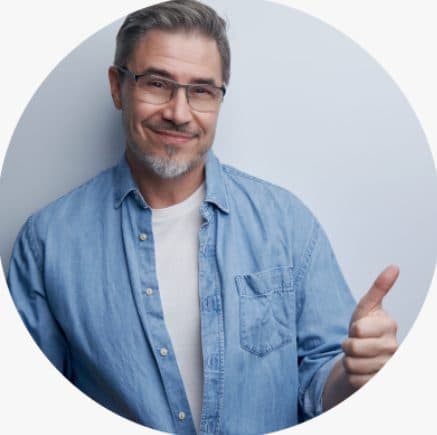Smiling man giving a thumbs up